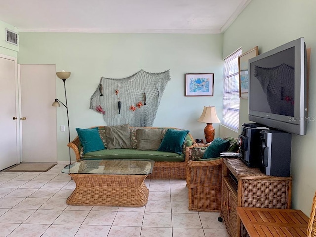 living room featuring crown molding and light tile patterned floors