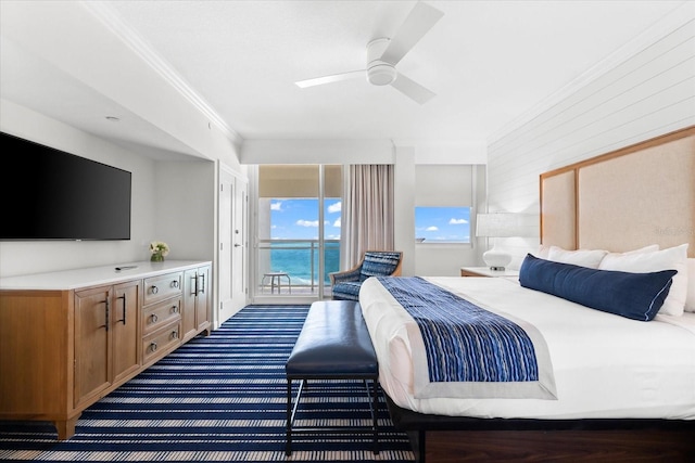 bedroom featuring access to outside, ceiling fan, a water view, and ornamental molding