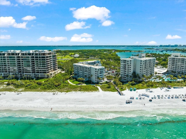 bird's eye view with a view of the beach and a water view