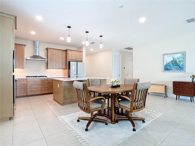 dining room with light tile patterned flooring and sink