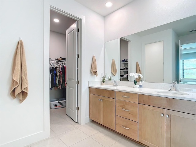 bathroom with tile patterned flooring and vanity