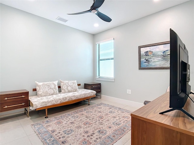 sitting room with ceiling fan and light tile patterned floors