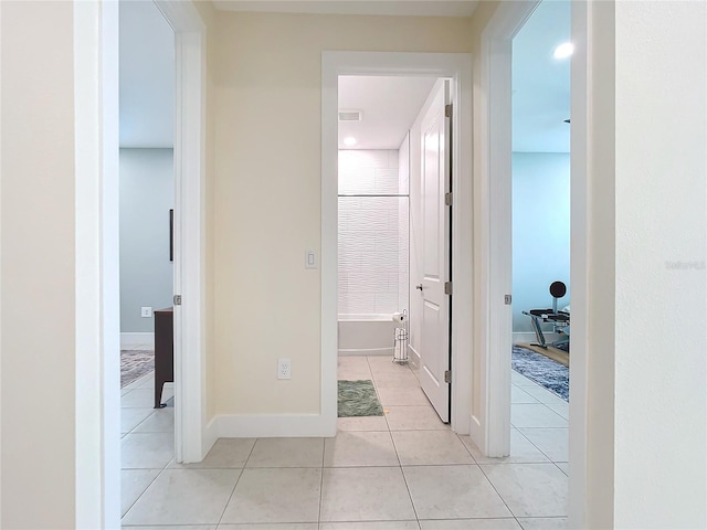 corridor with light tile patterned floors