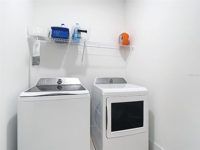 laundry area with separate washer and dryer