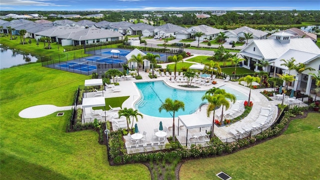 view of pool with a water view