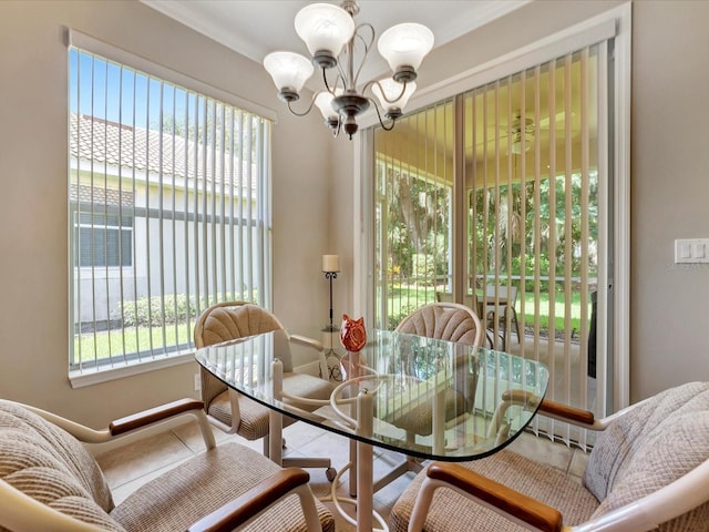 dining area with ceiling fan with notable chandelier and a healthy amount of sunlight