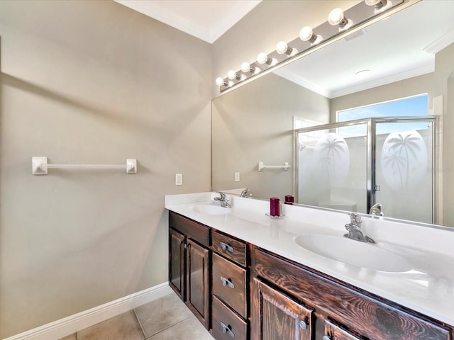 bathroom featuring an enclosed shower, vanity, tile patterned flooring, and crown molding