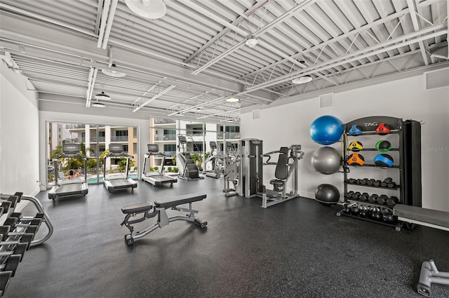 exercise room featuring baseboards and visible vents