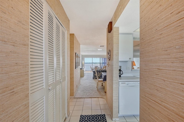 hall with light tile patterned flooring