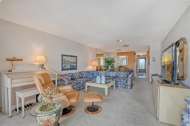 carpeted living room with a textured ceiling