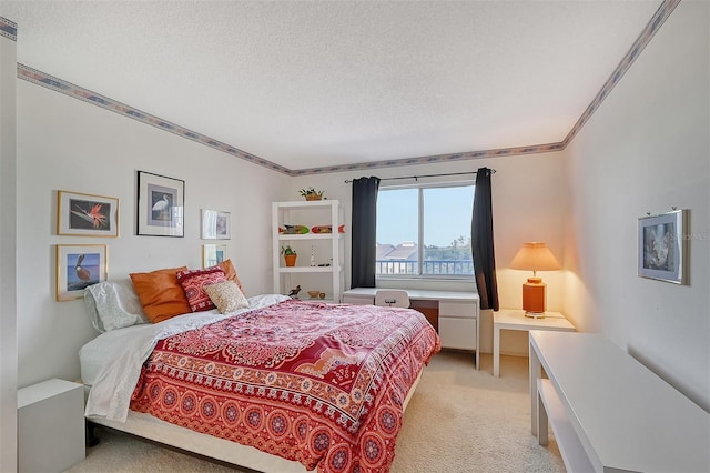 carpeted bedroom featuring ornamental molding and a textured ceiling