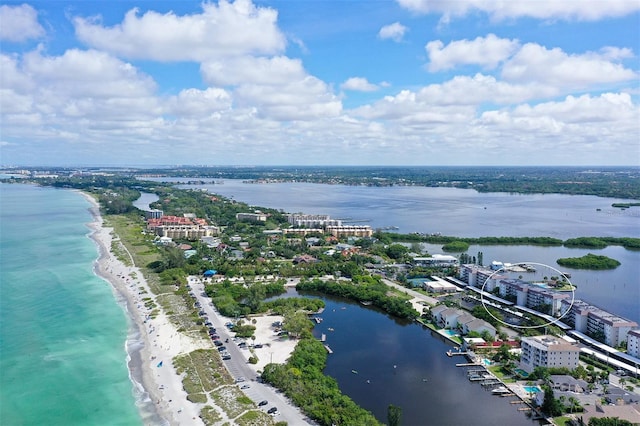 aerial view with a water view and a beach view