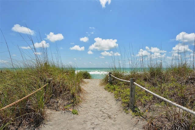 property view of water featuring a beach view