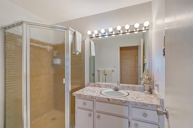 bathroom with vanity and an enclosed shower