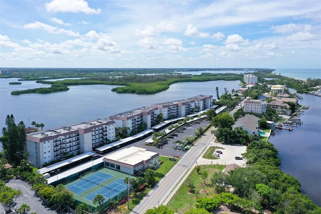 birds eye view of property with a water view