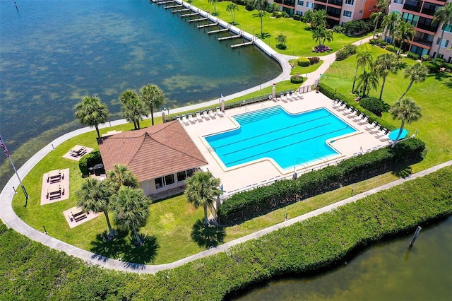 birds eye view of property with a water view