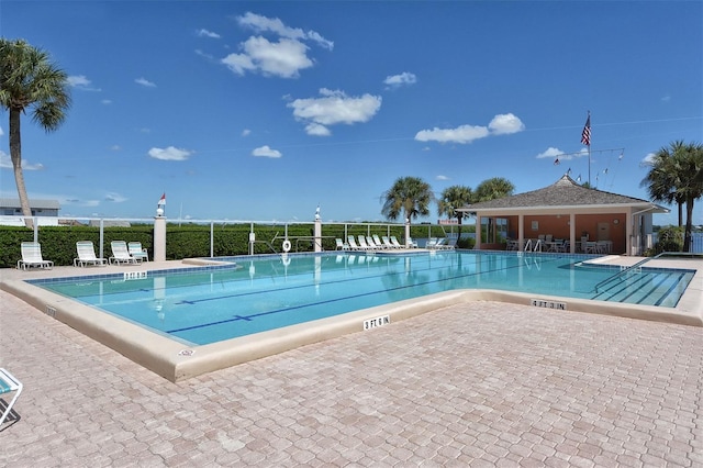 view of swimming pool with a patio