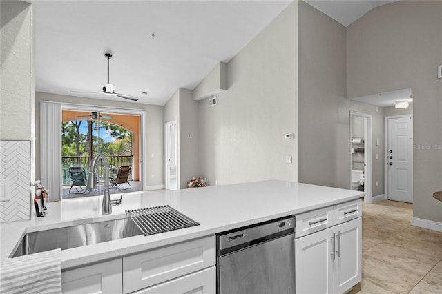 kitchen with white cabinetry, sink, lofted ceiling, and dishwasher