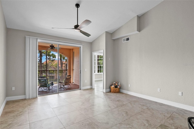 spare room featuring vaulted ceiling and ceiling fan