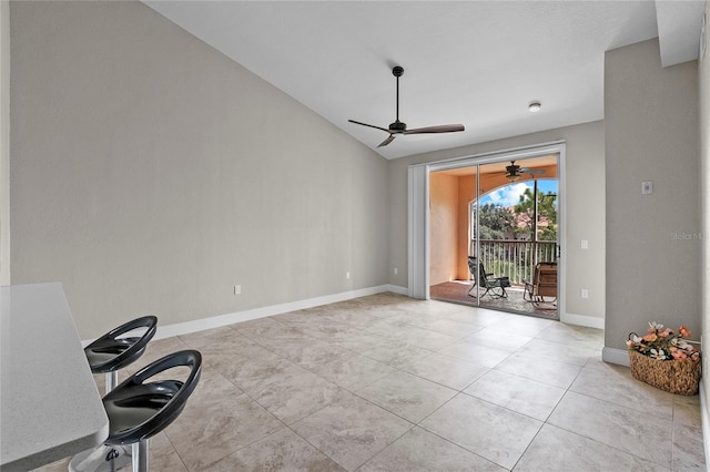 interior space with light tile patterned flooring and lofted ceiling