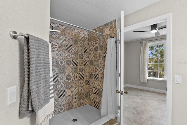 bathroom featuring tile patterned flooring, a shower with shower curtain, and a textured ceiling