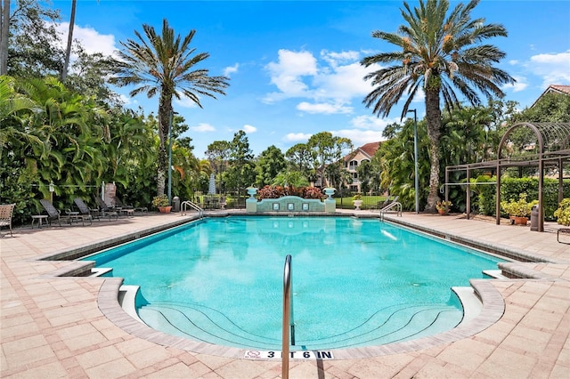 view of swimming pool featuring a patio