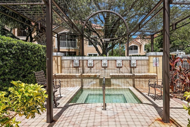 view of pool featuring a patio and a community hot tub