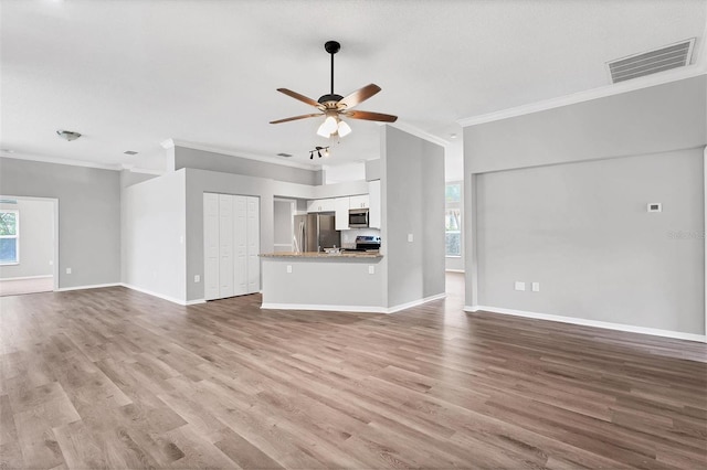 unfurnished living room with light hardwood / wood-style floors, ceiling fan, and crown molding