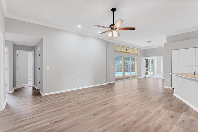 unfurnished living room with ceiling fan, crown molding, and light hardwood / wood-style flooring