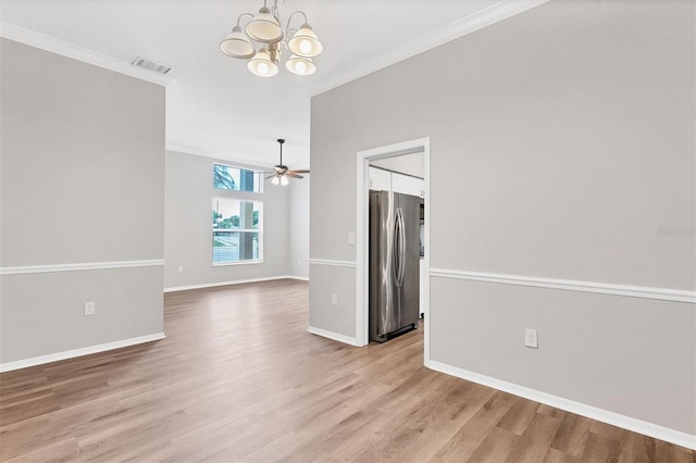 empty room featuring ceiling fan with notable chandelier, light hardwood / wood-style floors, and ornamental molding