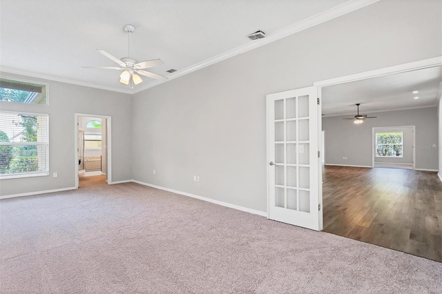 unfurnished room with carpet, french doors, ceiling fan, and ornamental molding