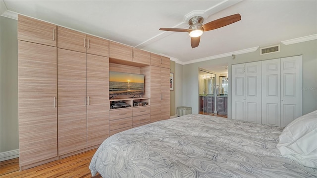 bedroom with ceiling fan, light wood-type flooring, and ornamental molding