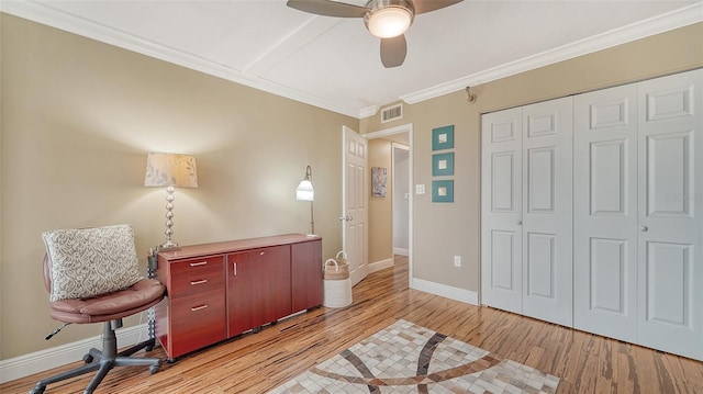 office area featuring ceiling fan, light hardwood / wood-style floors, and ornamental molding