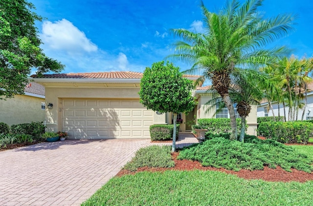 view of front of property with a garage