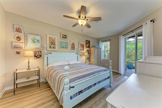 bedroom featuring ceiling fan, access to exterior, and light hardwood / wood-style flooring