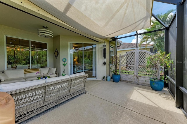 view of patio / terrace with outdoor lounge area and glass enclosure