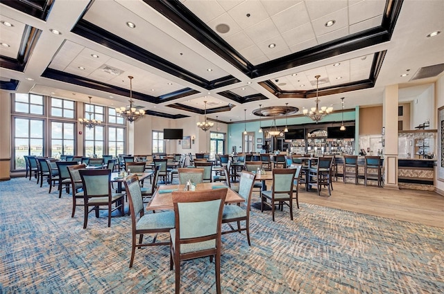 dining space with coffered ceiling, light wood-type flooring, a towering ceiling, ornamental molding, and beam ceiling