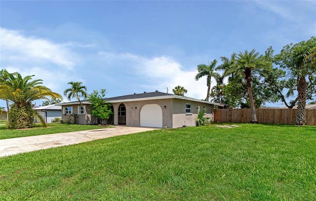 ranch-style home featuring a front yard and a garage