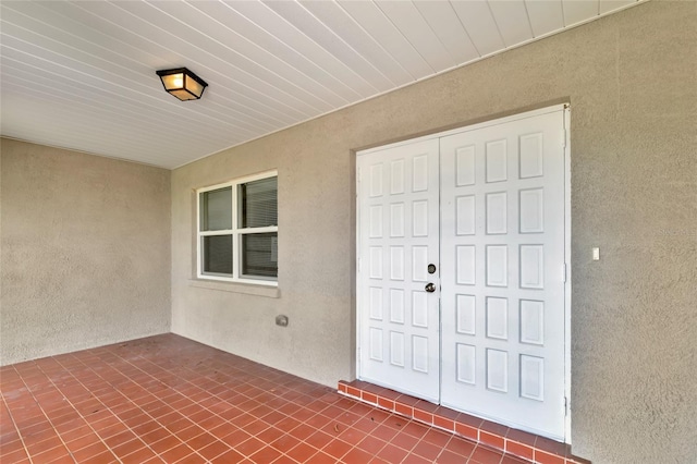 doorway to property with a patio area