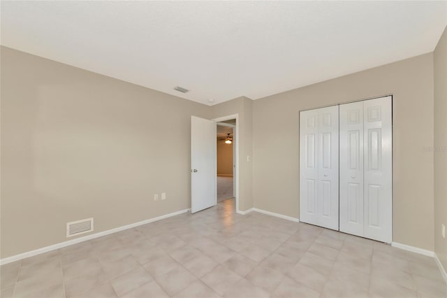 unfurnished bedroom with a closet