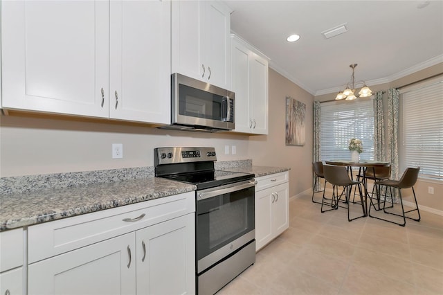 kitchen with light tile patterned floors, crown molding, appliances with stainless steel finishes, white cabinetry, and light stone counters