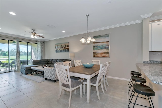 tiled dining room featuring crown molding and ceiling fan with notable chandelier