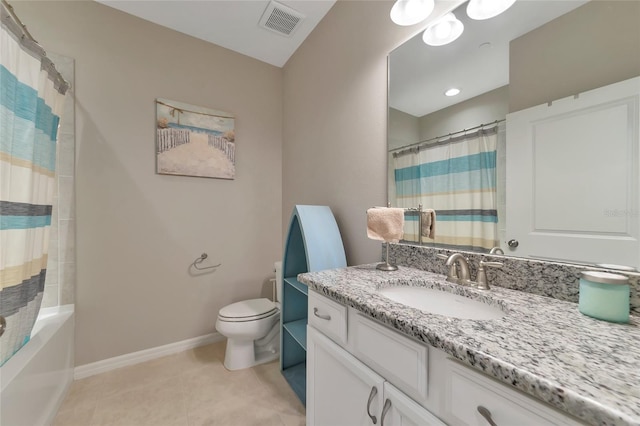 bathroom featuring tile patterned flooring, vanity, and toilet