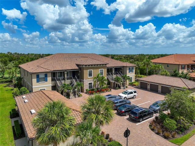 rear view of property with a garage