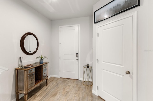 foyer with light hardwood / wood-style floors