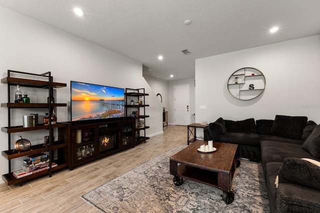 living room with a textured ceiling