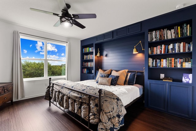 bedroom with ceiling fan and dark hardwood / wood-style floors