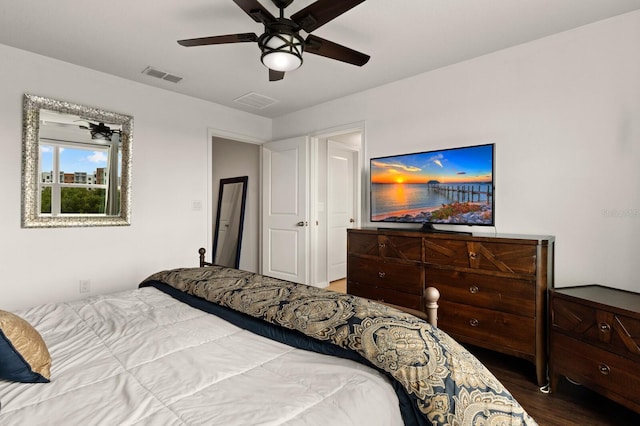 bedroom with ceiling fan and wood-type flooring