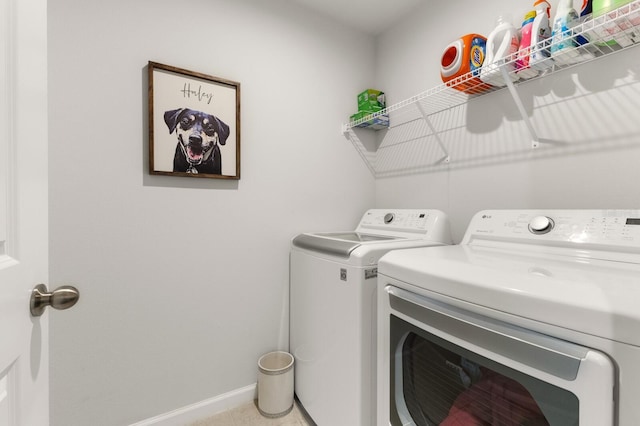 laundry area with independent washer and dryer