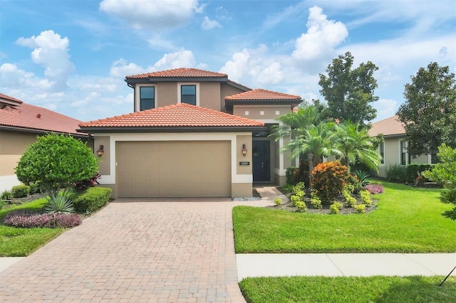 mediterranean / spanish home featuring a front lawn